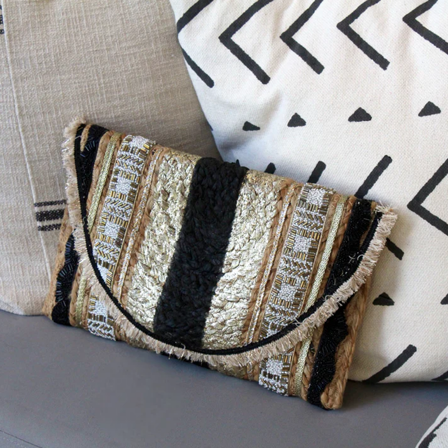 gold and black stripe clutch