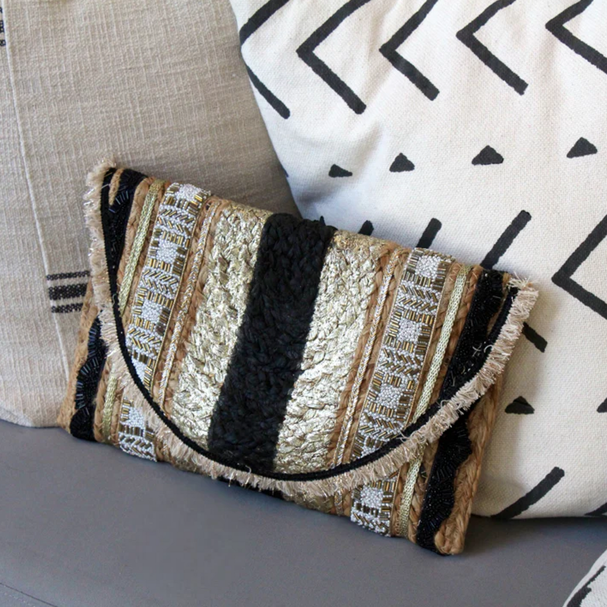 gold and black stripe clutch