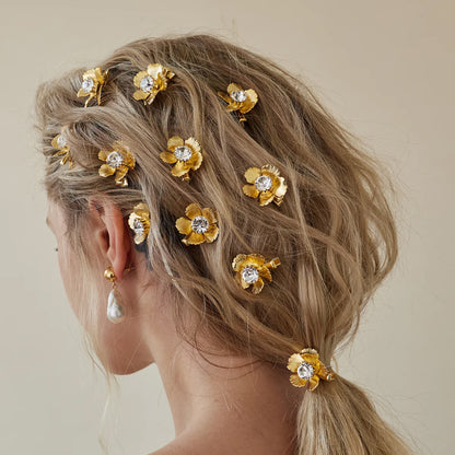 مجموعة مشابك للشعر على شكل أزهار
