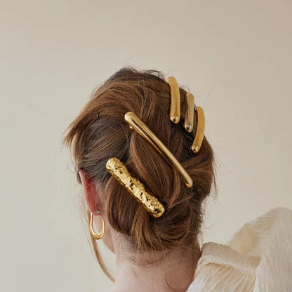 مشبك شعر على شكل لوح مُطرَّق